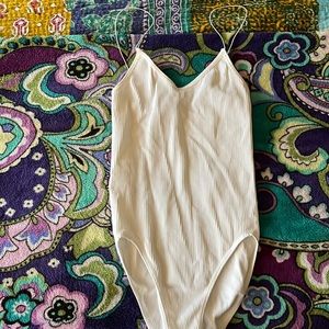 Out from under body suit